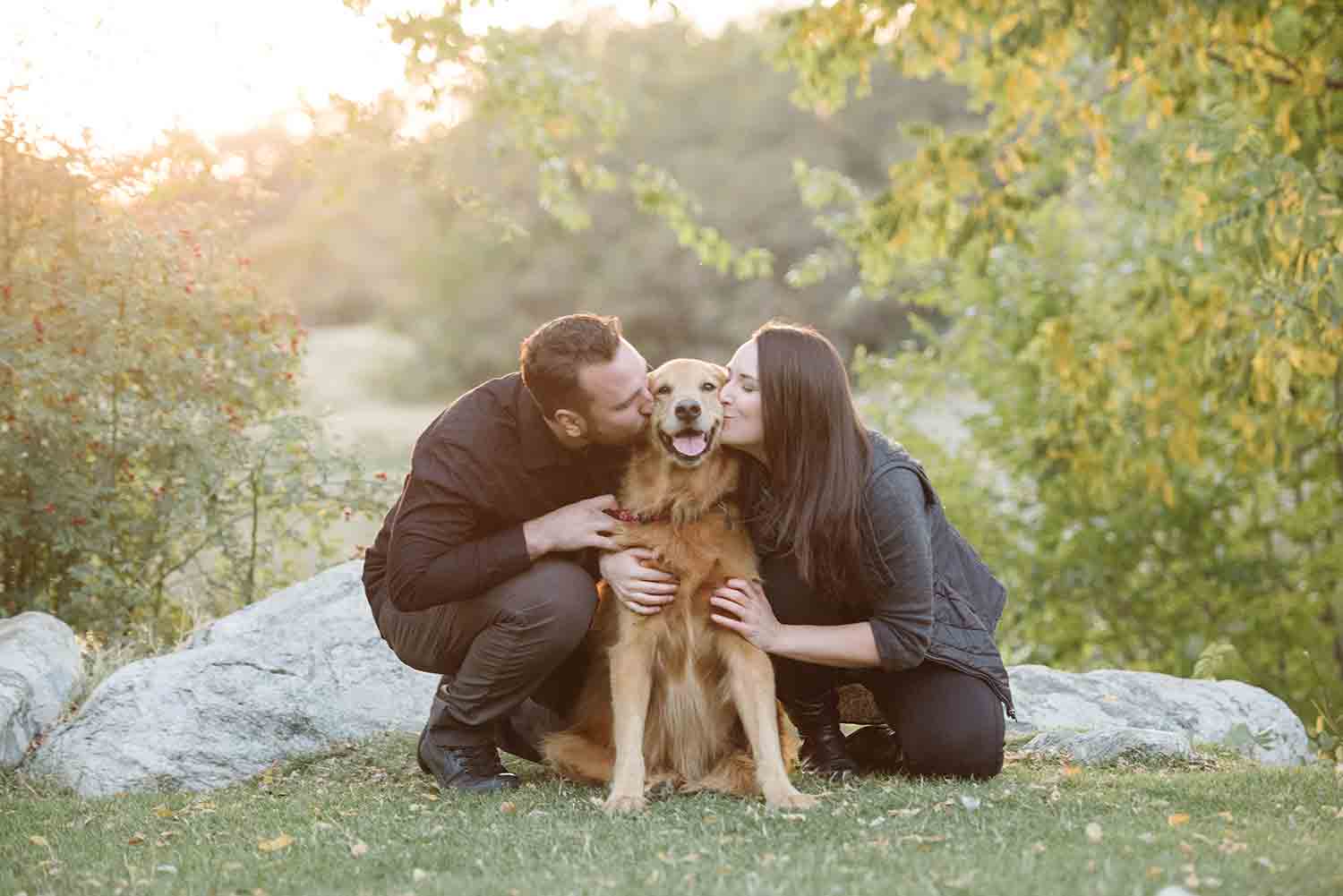 kissing dog in park